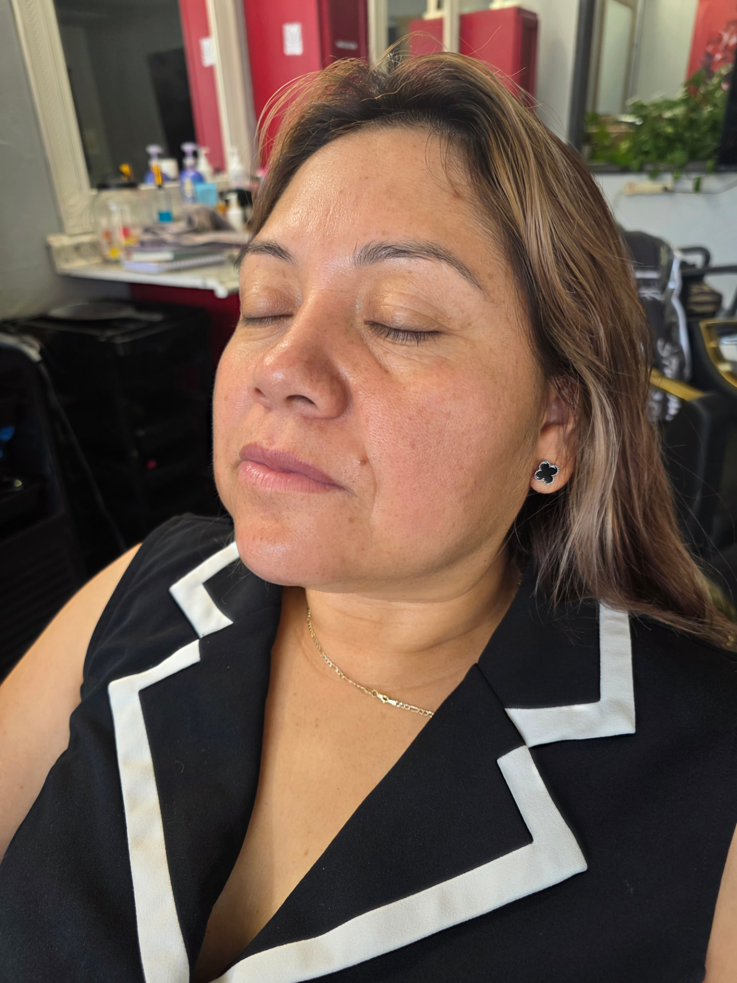 Close-up of a client without eye makeup, with skin prepared before the service