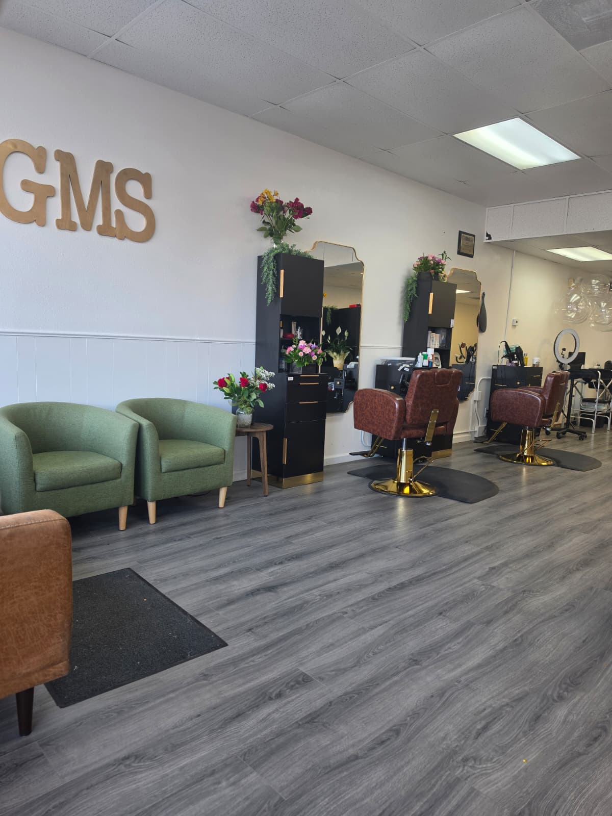Interior of GMS Beauty Salon with styling chairs and stations in Madera, California